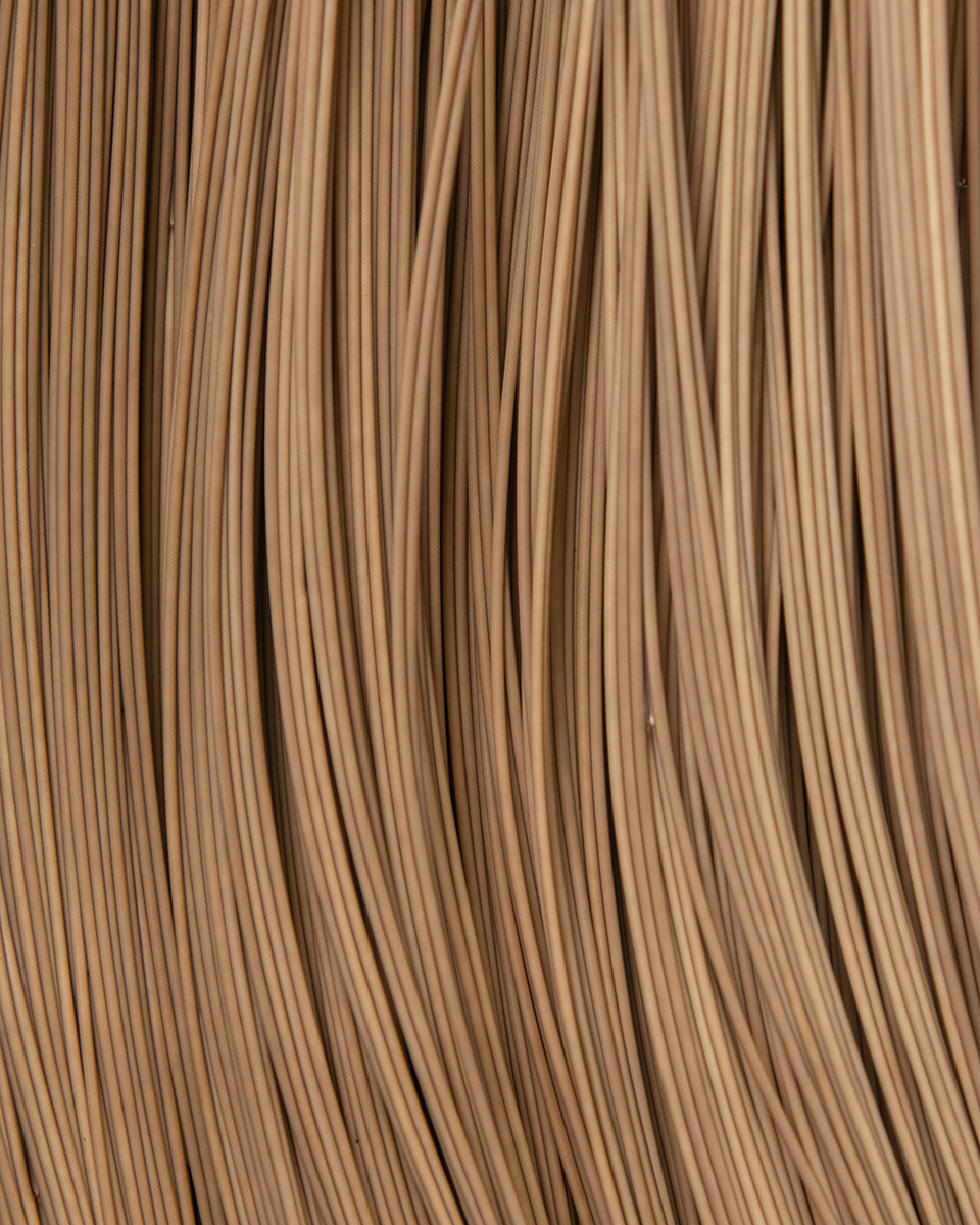 Several vertical layers of tan material create a membrane filter.