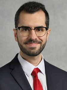 Mohammad Hashemi smiles for a portrait.