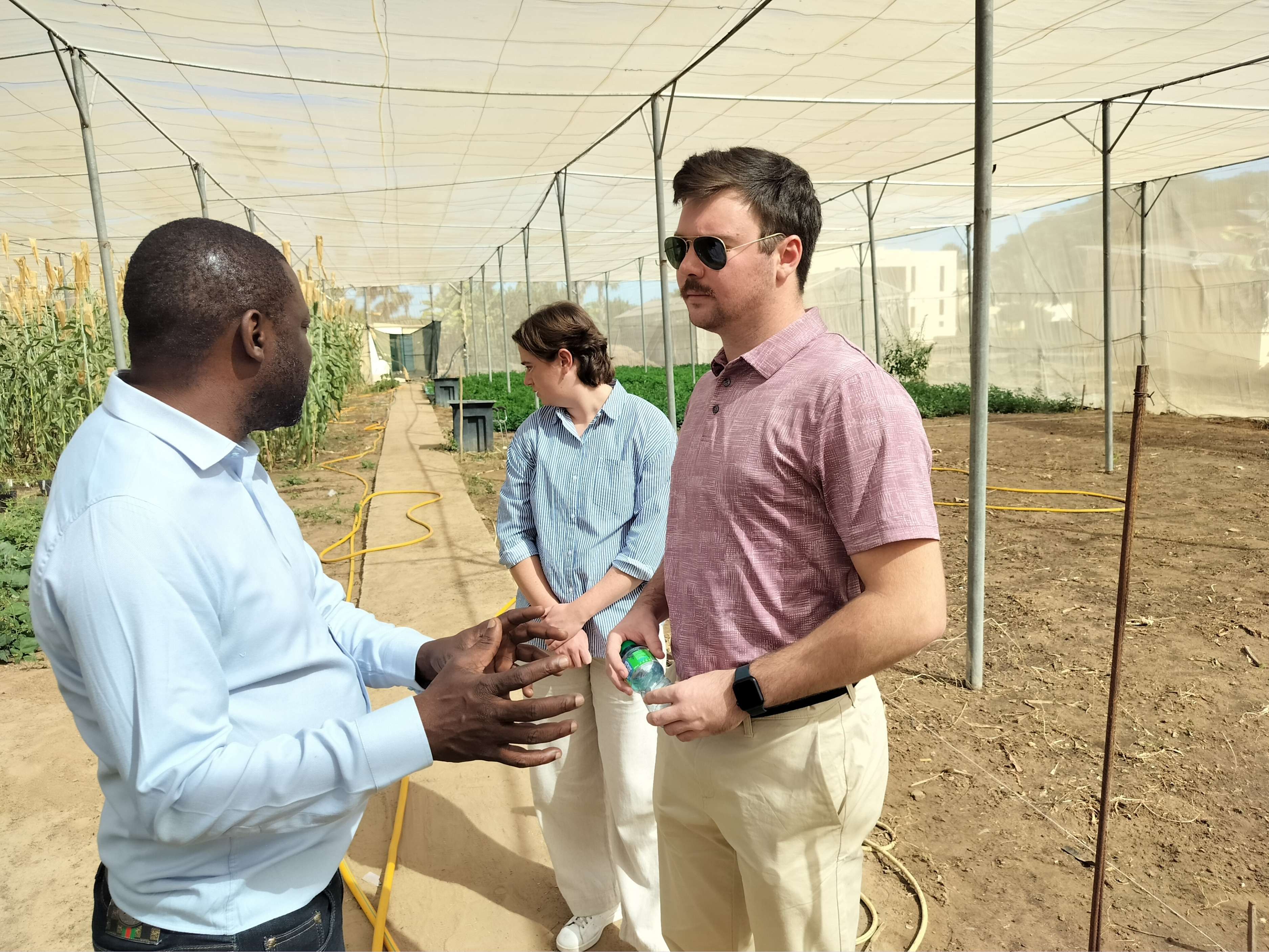 Brooks and Cochran speak with Kane while touring the CERAAS facility
