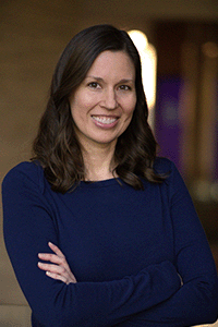 Melissa Glasser smiles for a professional portrait. 