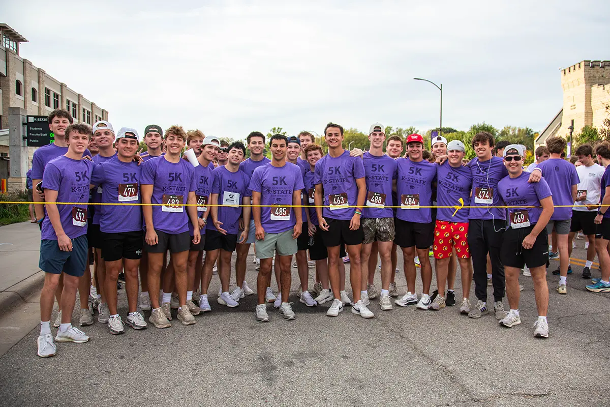 A group of guys posing for a photo at the beginning of the race.